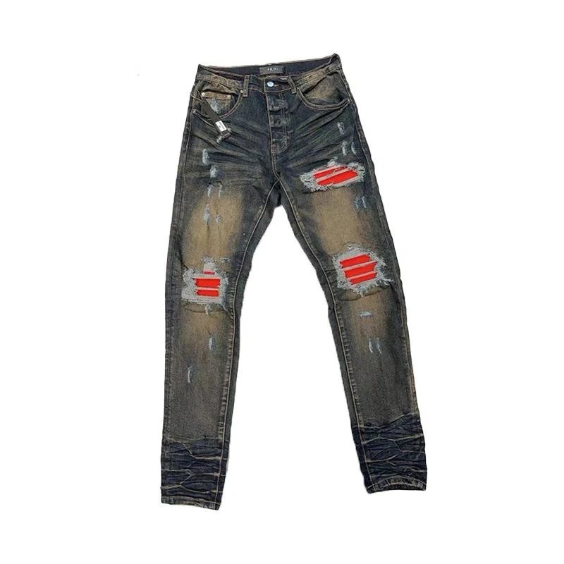 Amiri Logo Ripped Jeans